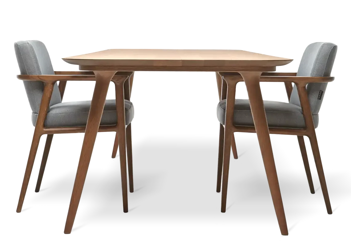 a table with two chairs facing each other